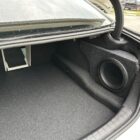 BMW M5 trunk with dual custom subwoofer enclosures installed